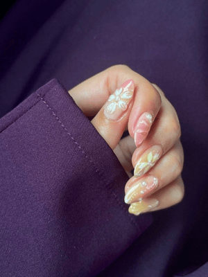 Stunning 3D floral gel design on natural nails, expertly done by Riri Nails in Muscat Oman