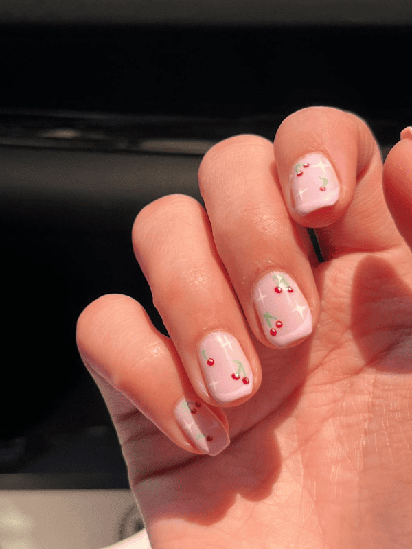 Riri Nails Oman Gel on natural nails in baby pink with cherry minimal nail art