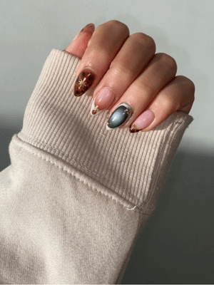 Cosmic galaxy GelX nail extension design on natural nails by Riri Nails Oman
