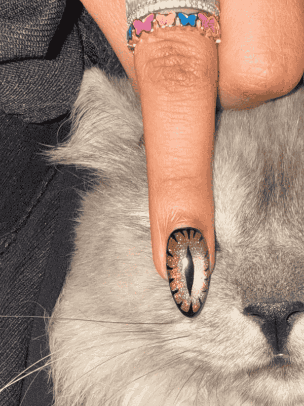 Golden GelX extension cat-eye nail art design by Riri Nails in Muscat Oman