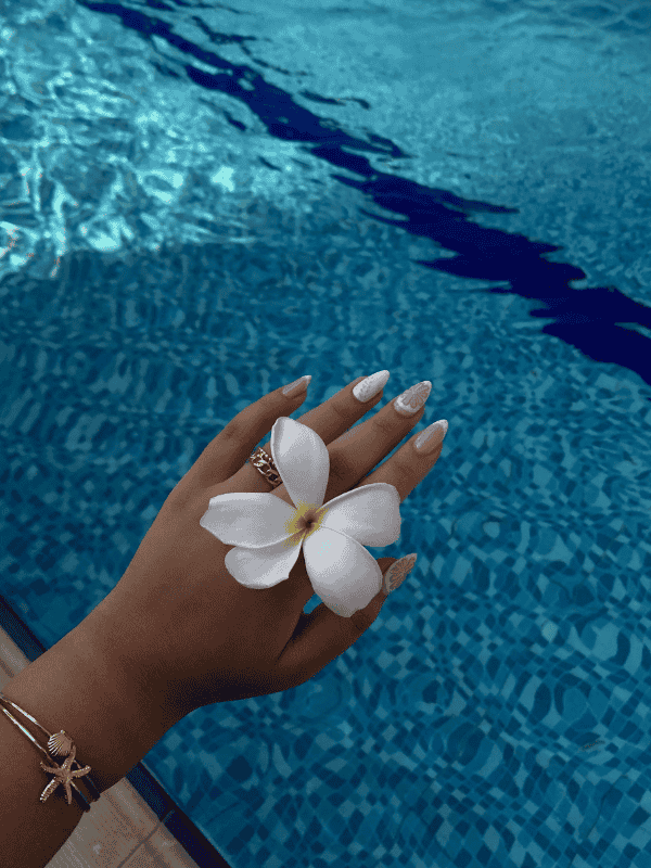 Riri Nails Oman GelX extension in white and beige with ocean-inspired nail art