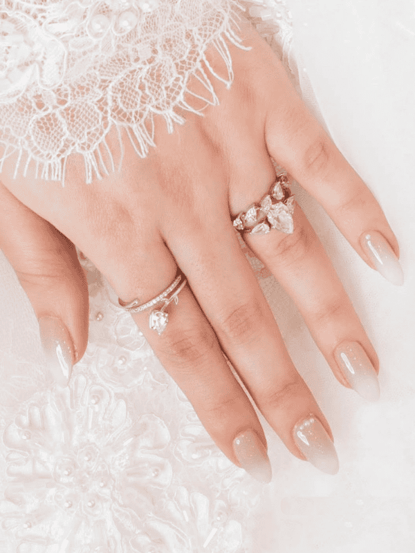 GelX nail extension in white glacier with sparkle nail art - Riri Nails Oman