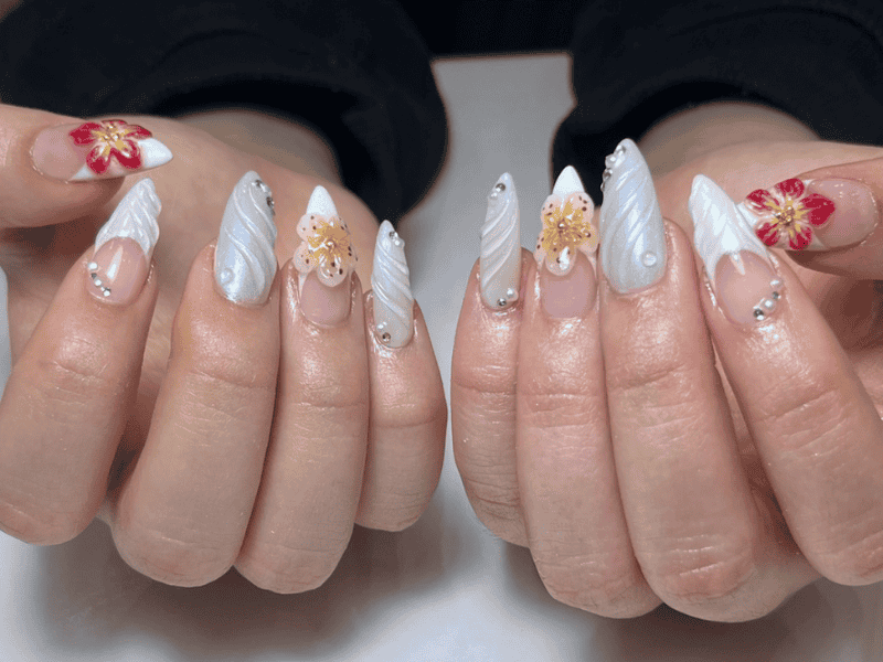 Riri Nails Oman GelX nail extension with 3D wavy glittered floral nail art for elegant nails