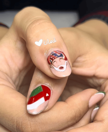 Gel on natural nails featuring Oman flag and Sultan face nail art design by Riri Nails salon in Muscat, Oman.