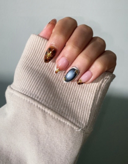 Riri Nails Oman GelX extension with multicolor nail art design featuring vibrant shades and glossy finish.