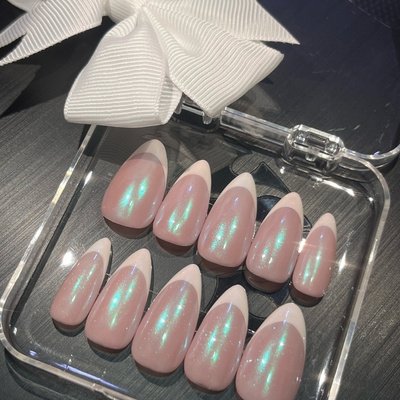 Nude base French tip press-on nails with soft pinkish white tips by Riri Nails in Muscat, Oman