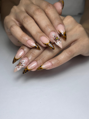 Riri Nails Oman Builder Gel nail service featuring wild yellow floral design at muscat Oman